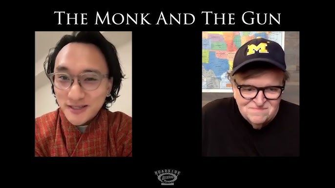 Screen shot of Dorji speaking with Michael Moore in a YouTube Q&A.
