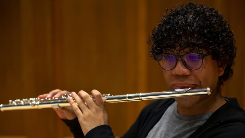 Student playing flute in Lawrence competition